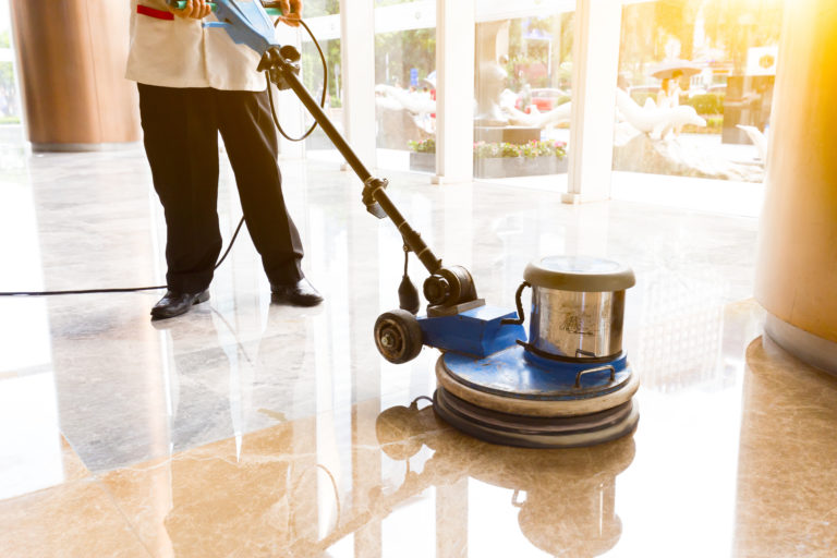person-polishes-floor-cleaning-angels-company